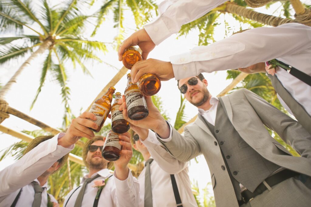Groomsmen and groom with beers