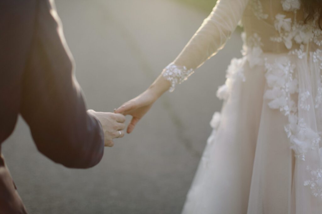 Newly weds holding hands