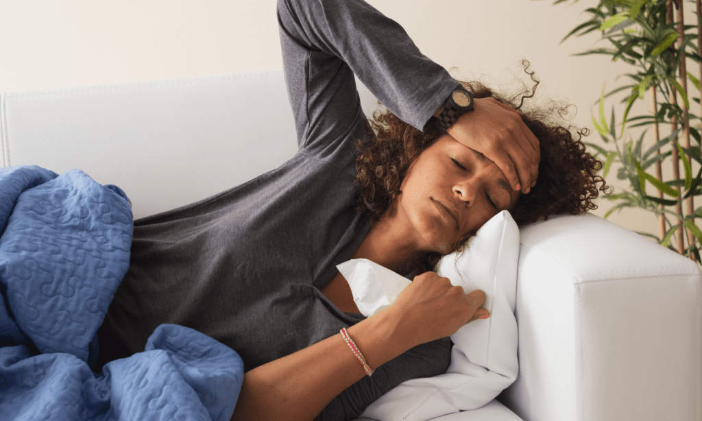 Woman with cold on couch